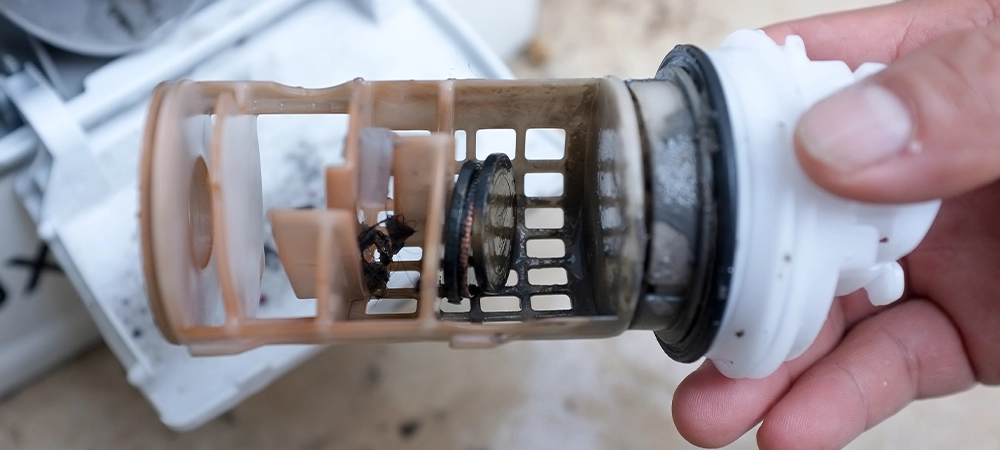 coins and buttons left in drain pump Coins in washing machine's drain pump filter
