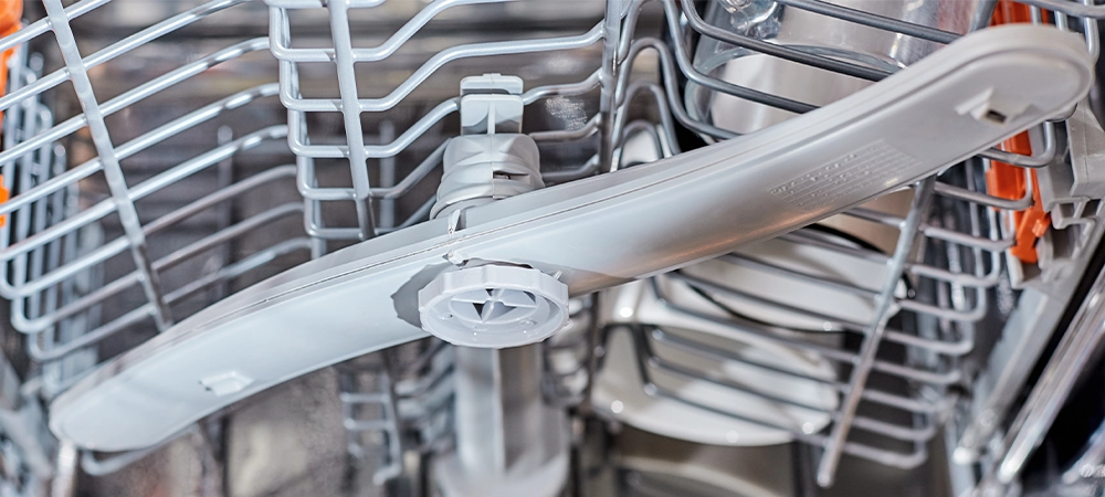 Worker repair dishwasher at home.