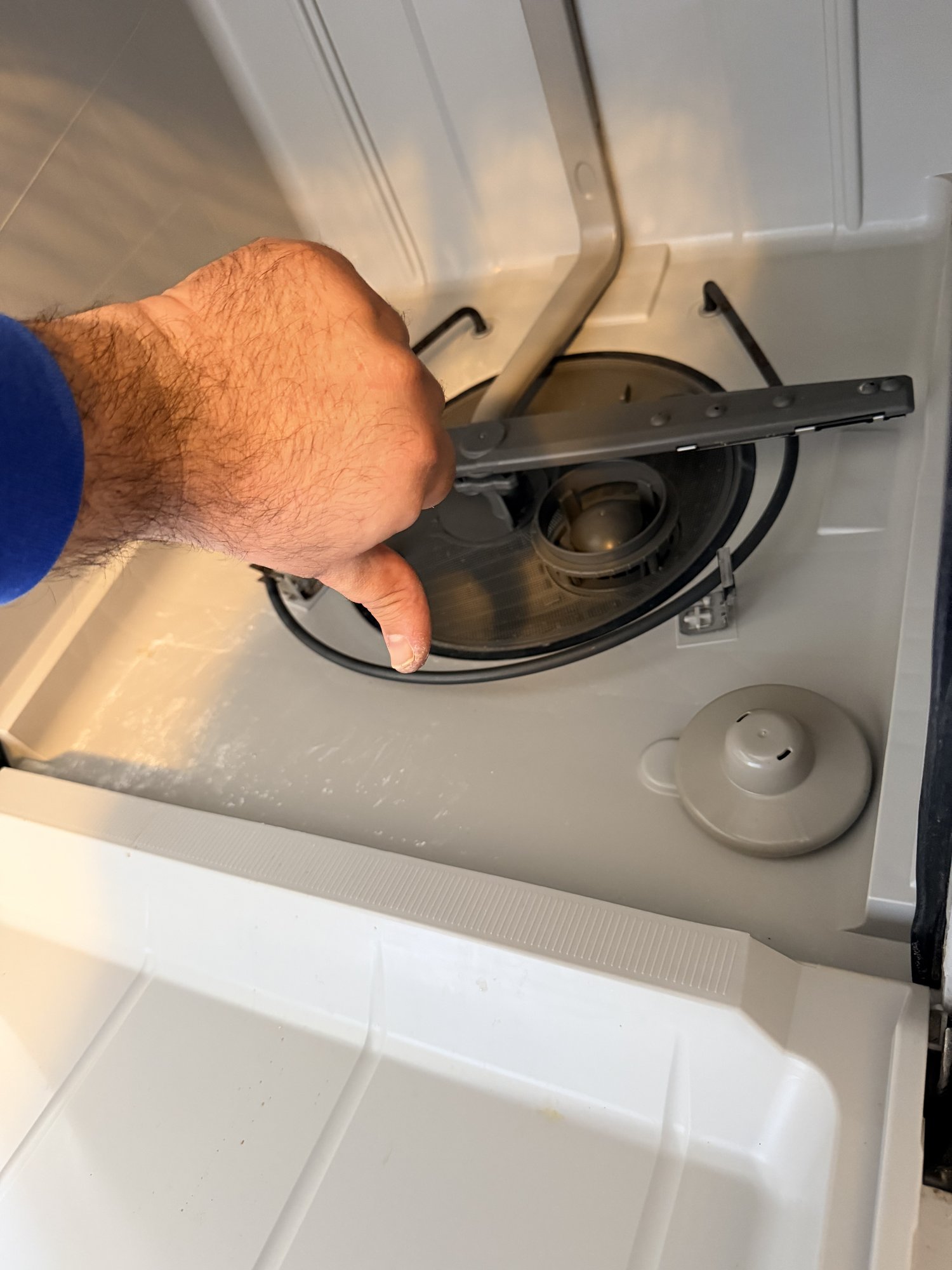 appliance dishwasher repair east gwillimbury person’s hand removing applianceforever ca
