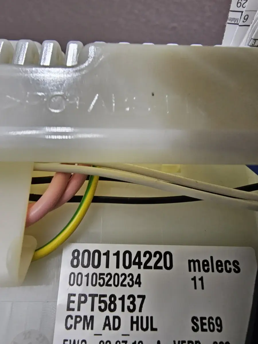 appliance repair close up device colored wires white label showing codes like 80