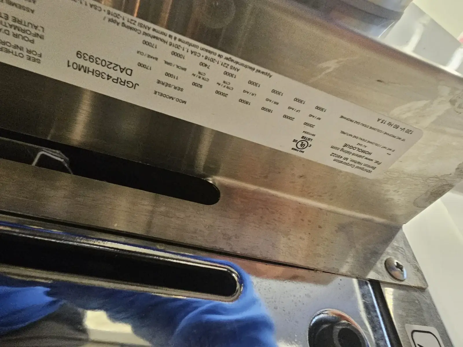appliance repair close up metal appliance manufacturer s label serial number par
