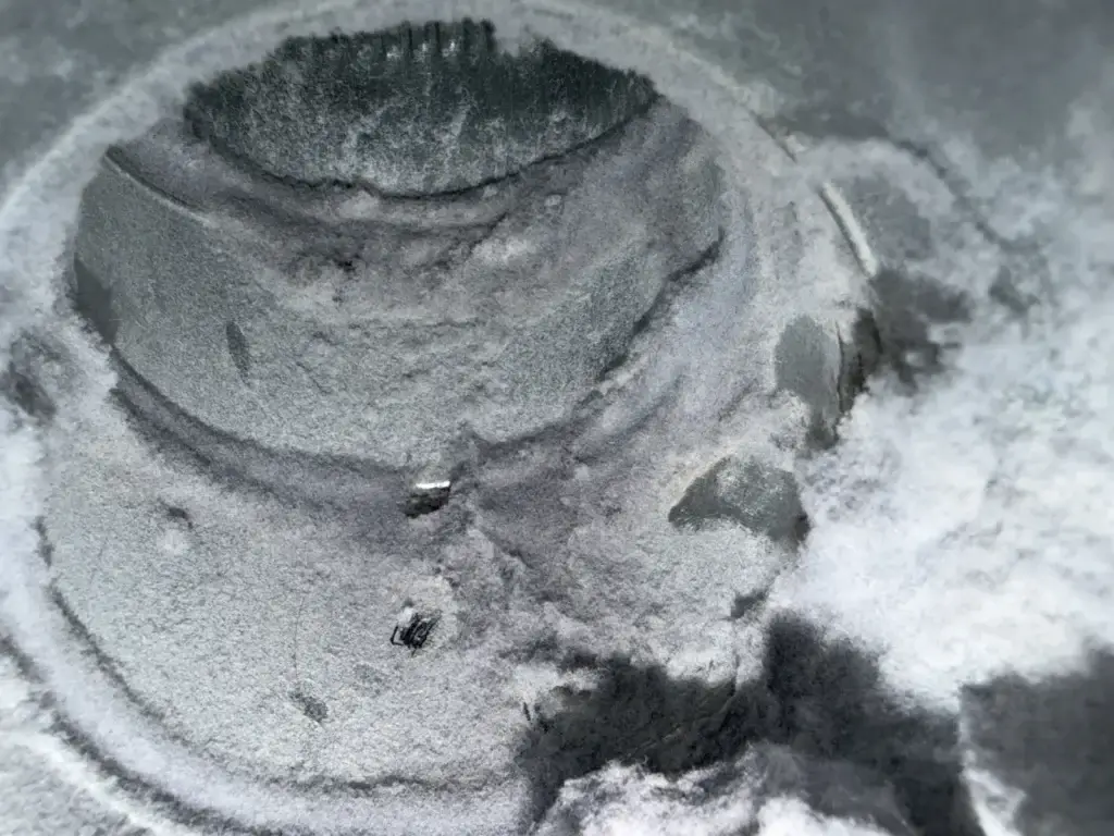 appliance repair close up metallic circular surface coated gray dust powder show