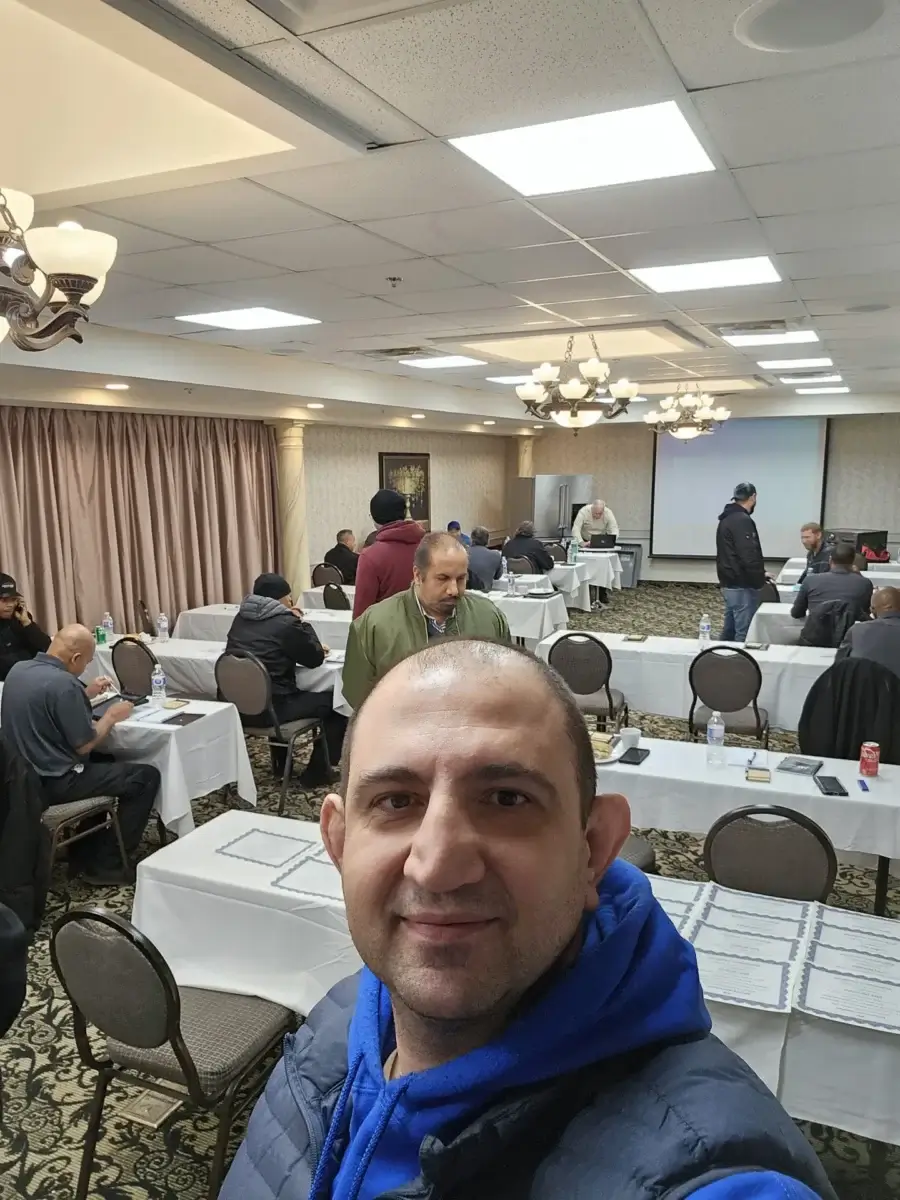 appliance repair man takes selfie bradford ontario conference room where several