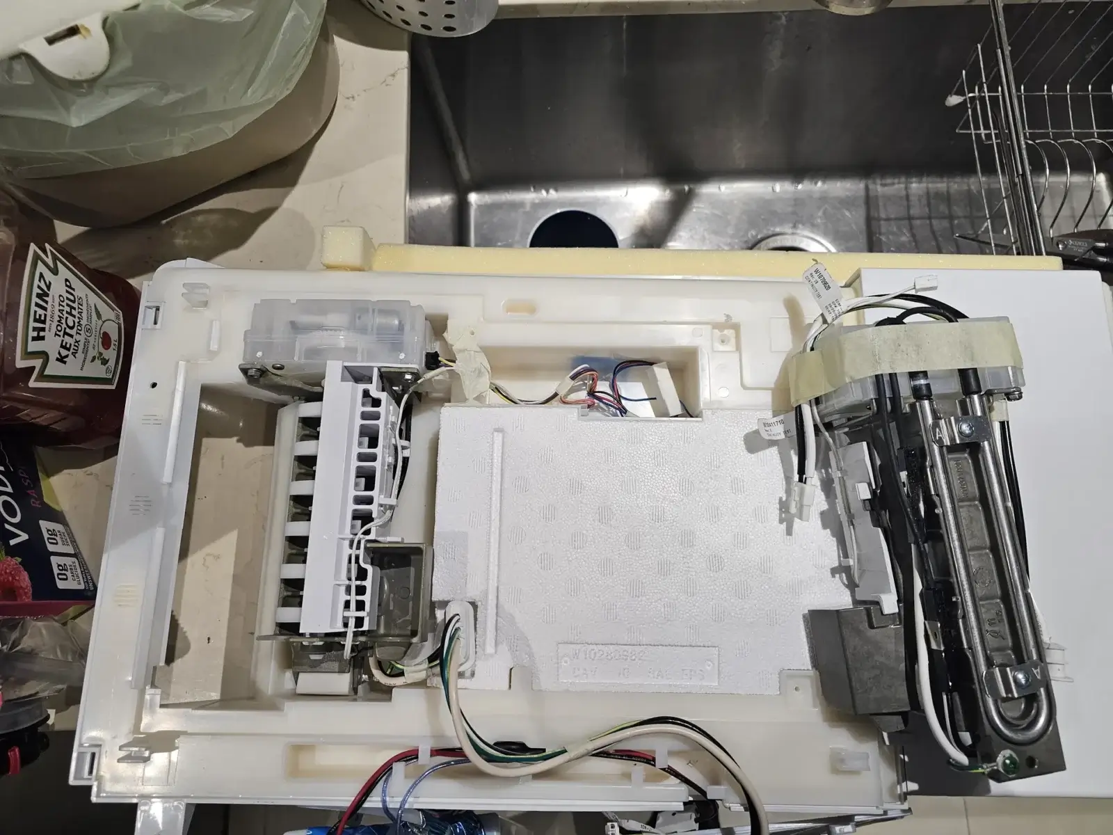 appliance repair open appliance panel showing internal components wiring placed