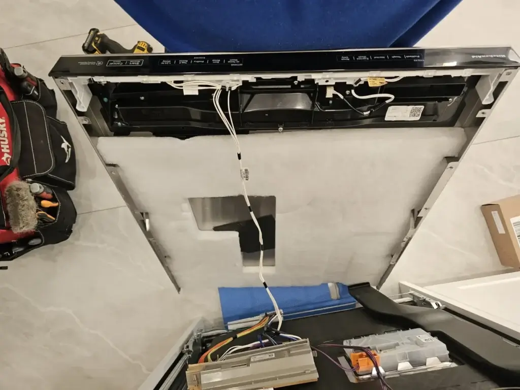KitchenAid dishwasher door fully disassembled during a control repair on an older unit