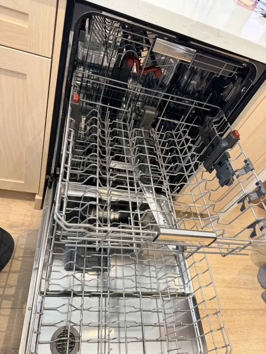 dishwasher repair open dishwasher empty racks viewed above clean modern kitchen
