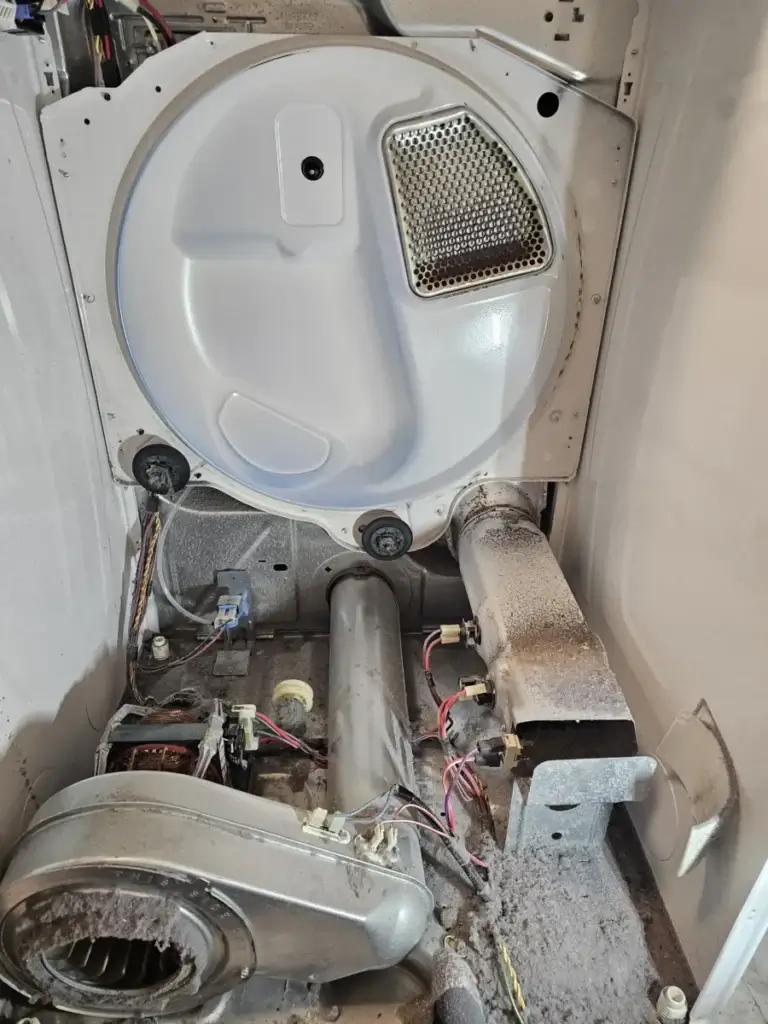 dryer repair interior dryer back panel removed bradford ontario showing drum wir