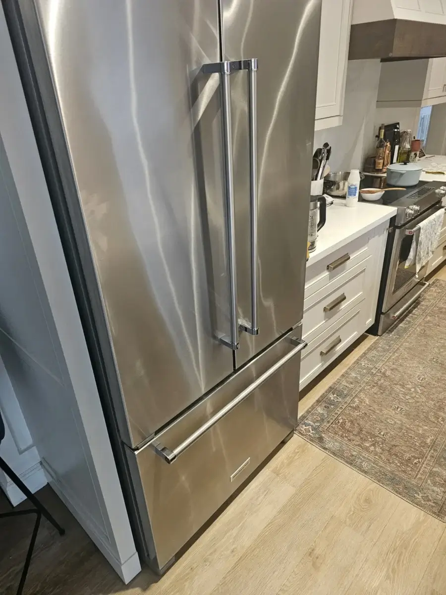 Stainless steel French-door refrigerator, the type most prone to defrost-drain and water-line leaks