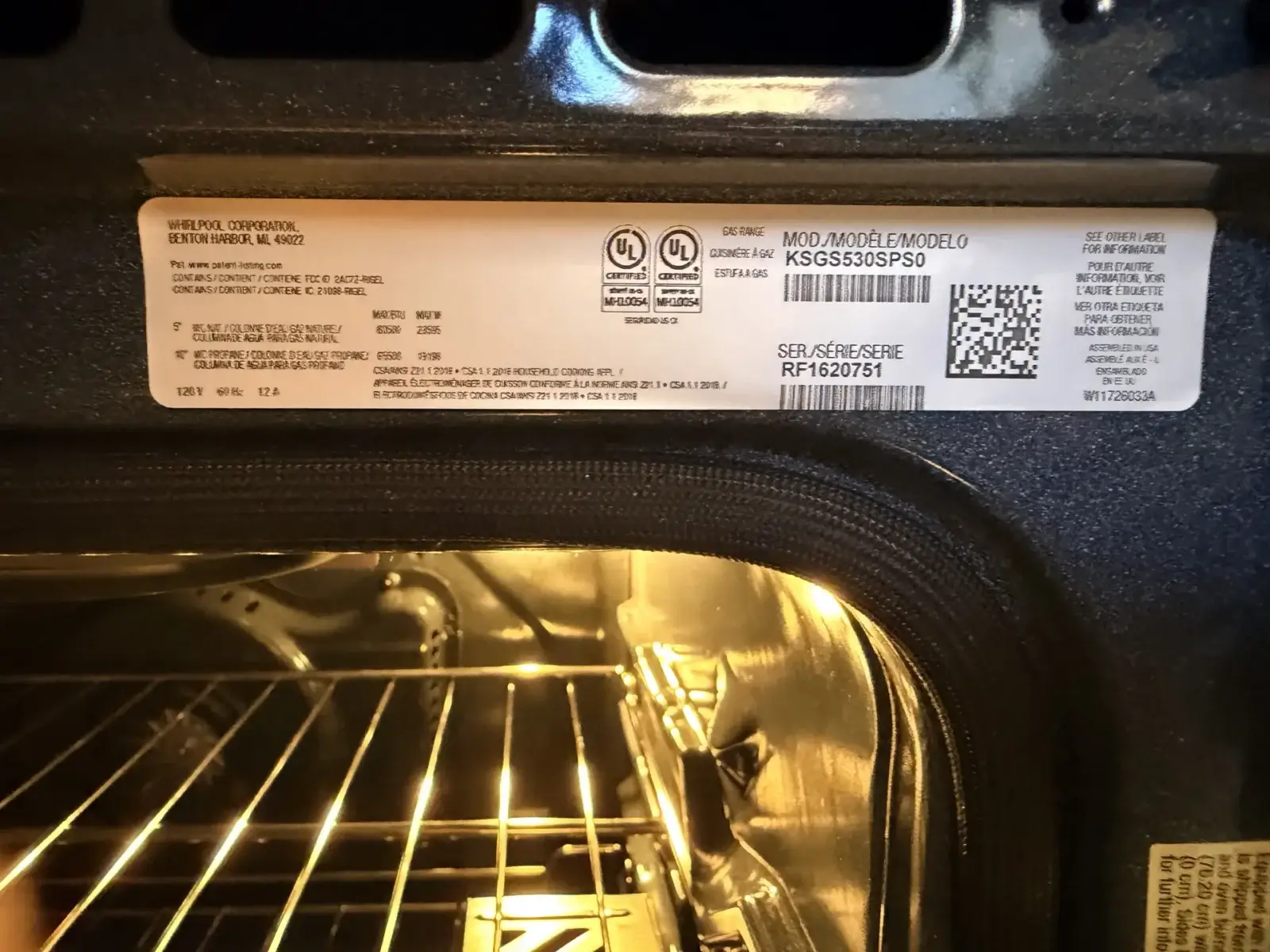 oven repair close up oven door open bradford ontario showing label model serial