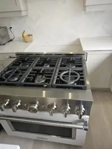 Six-burner stainless steel gas rangetop in a GTA kitchen