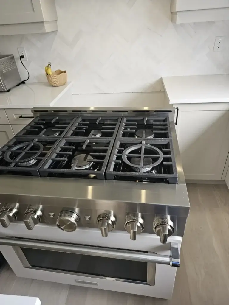 Six-burner stainless steel gas rangetop in a GTA kitchen