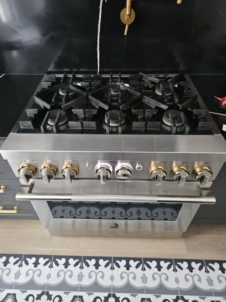 stove repair stainless steel gas stove six burners gold knobs stands out against