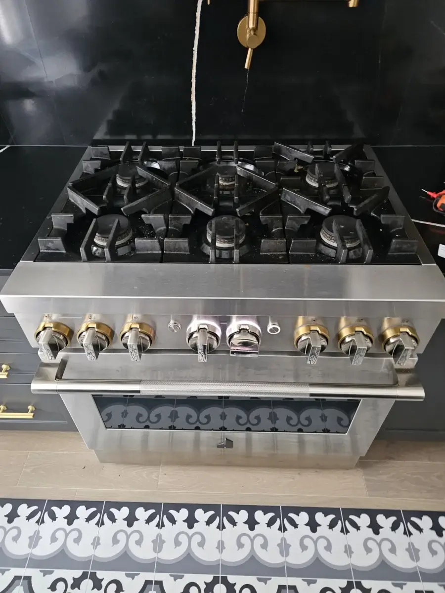 stove repair stainless steel gas stove six burners gold knobs stands out against