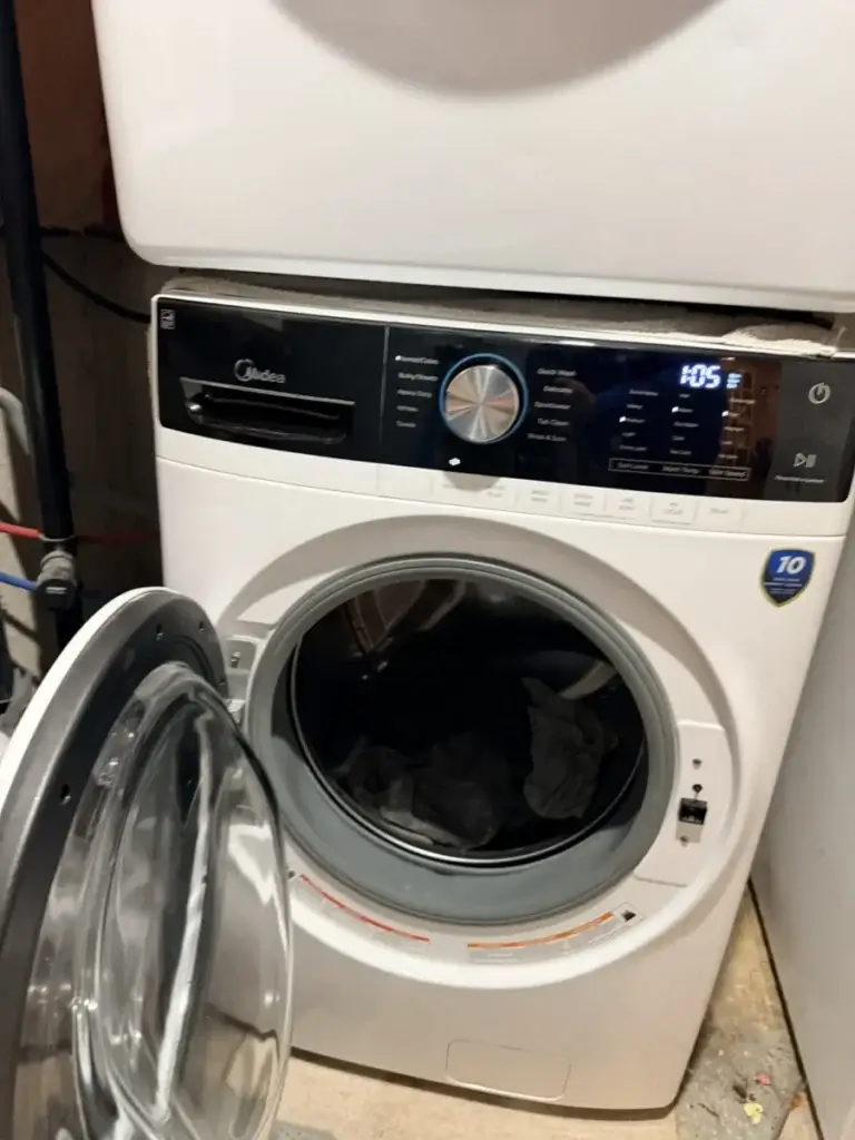 Front-load washer stopped mid-cycle with laundry in the drum