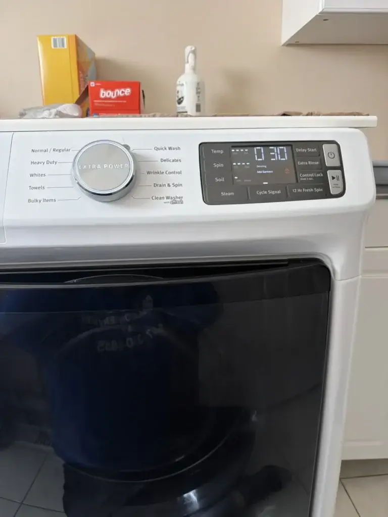 Washer control panel paused mid-cycle - the classic symptom of the LG UE unbalanced-load error