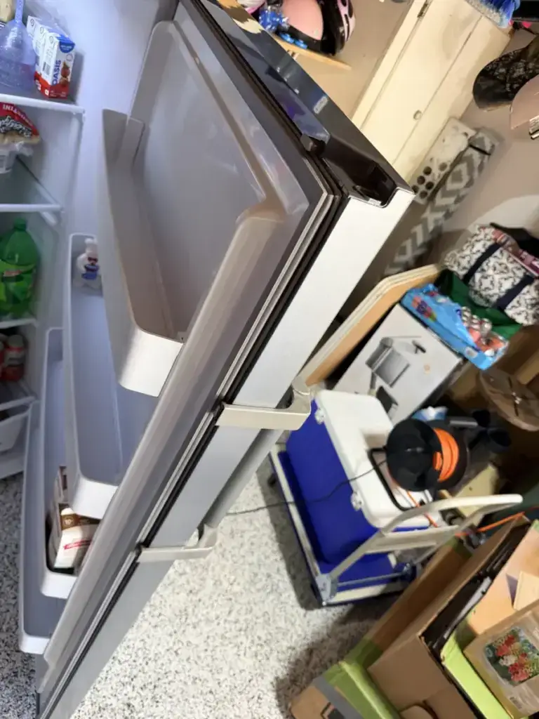 Refrigerator tipped on its side for compressor access during a repair